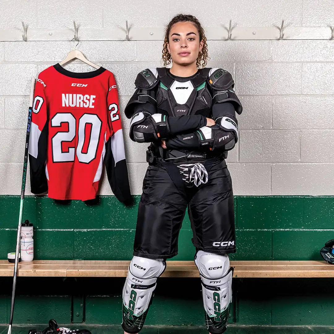 Red and black ccm hockey jersey with white number 20 and name ’nurse’ displayed on the back.
